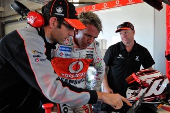 car Craig Lowndes' engineer Jeromy Moore speaks with Warren Luff