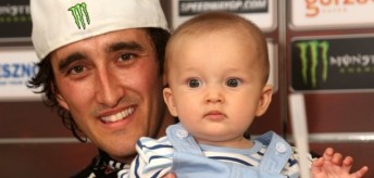 thumb A victorious Chris Holder with 5 month old son Max