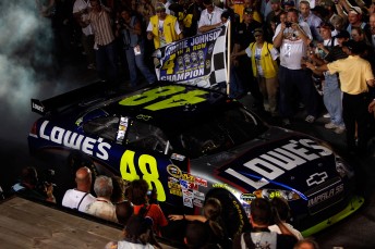 thumb Jimmie Johnson makes his way to collect his record breaking fourth-straight NASCAR Sprint Cup Series title