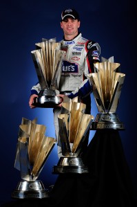 2009 NSCS Jimmie Johnson trophies tiered Jimmie Johnson and his four Sprint Cup Series championship trophies