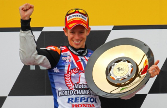 thumb Casey Stoner celebrates his world title win