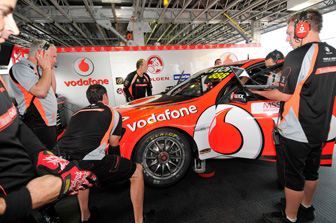 car Craig Lowndes with his TeamVodafone squad at the AGP