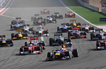 car The Formula One field stream into Turn 1 in 2010