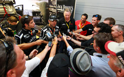 thumb Kelly Racing's Todd and Rick Kelly, alongside Nissan's Ian Moreillon in a press huddle