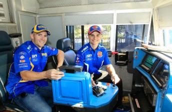 th The two drivers survey the controls