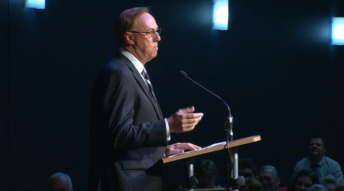 Geoff Brabham delivering his tribute at the service in Southport, Queensland