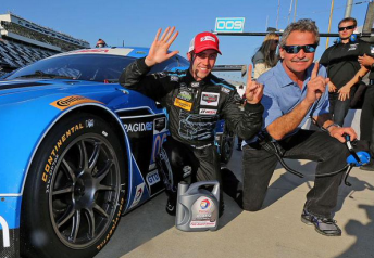 James Davison celebrates GTD pole with team owner Kevin Buckler