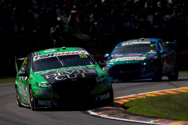 Dave Reynolds leads Chaz Mostert on his way to victory in Race 15