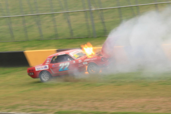 The Collins Mustang collects the wall on the front straight