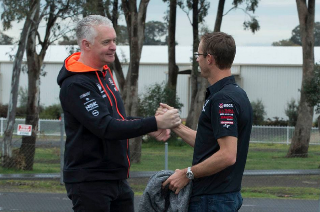 Walkinshaw managing director Adrian Burgess greets Bourdais upon arrival
