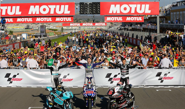 Basking in their freshly won championships from left, Danny Kent (Moto3), Jorge Lorenzo (MotoGP) and Johann Zarco (Moto2).