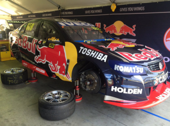Lowndes' rebuilt car in the pit garage