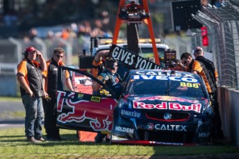 Lowndes' car following heavy contact with the outside wall
