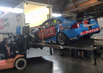 A forklift being used to help lower the car to the ground